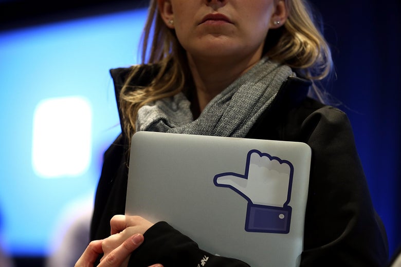 MENLO PARK, CA - APRIL 04: A Facebook employee holds a laptop with a 'like' sticker on it during an event at Facebook headquarters during an event at Facebook headquarters on April 4, 2013 in Menlo Park, California. Facebook CEO Mark Zuckerberg announced a new product for Android called Facebook Home as well as the new HTC First phone that will feature the new software. (Photo by Justin Sullivan/Getty Images)